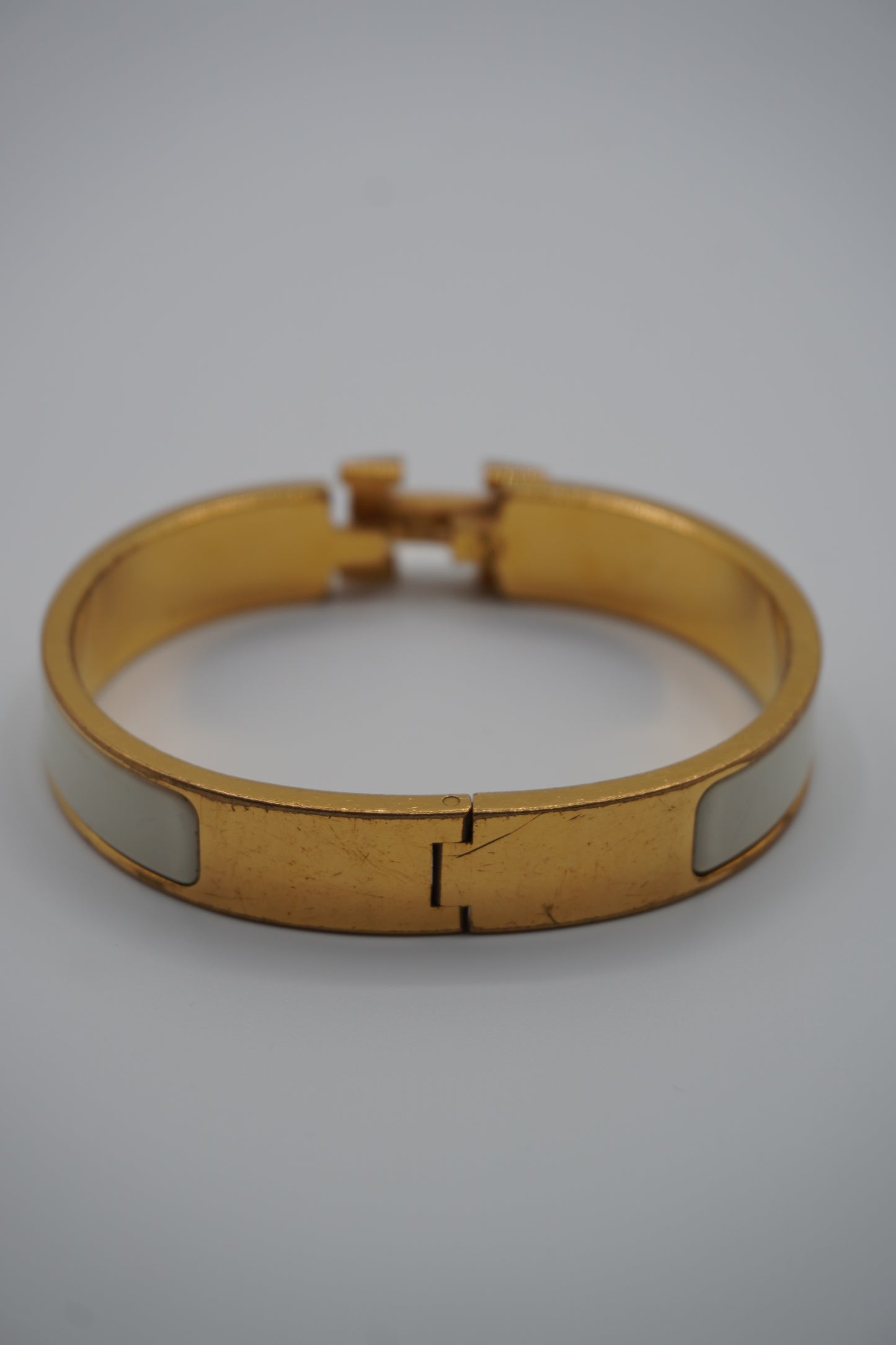 Hermès Clic H Bracelet in Gold & White Enamel