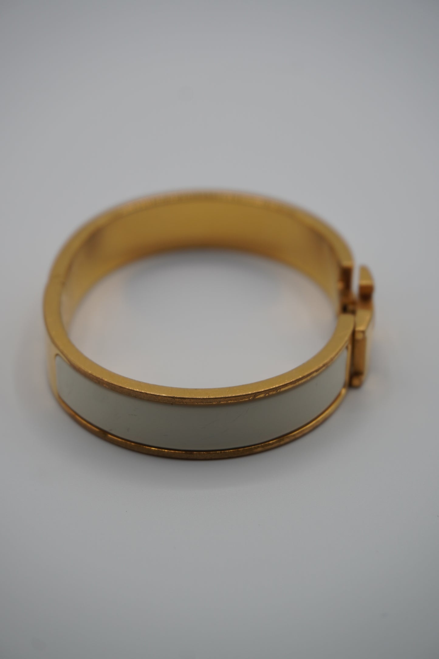 Hermès Clic H Bracelet in Gold & White Enamel