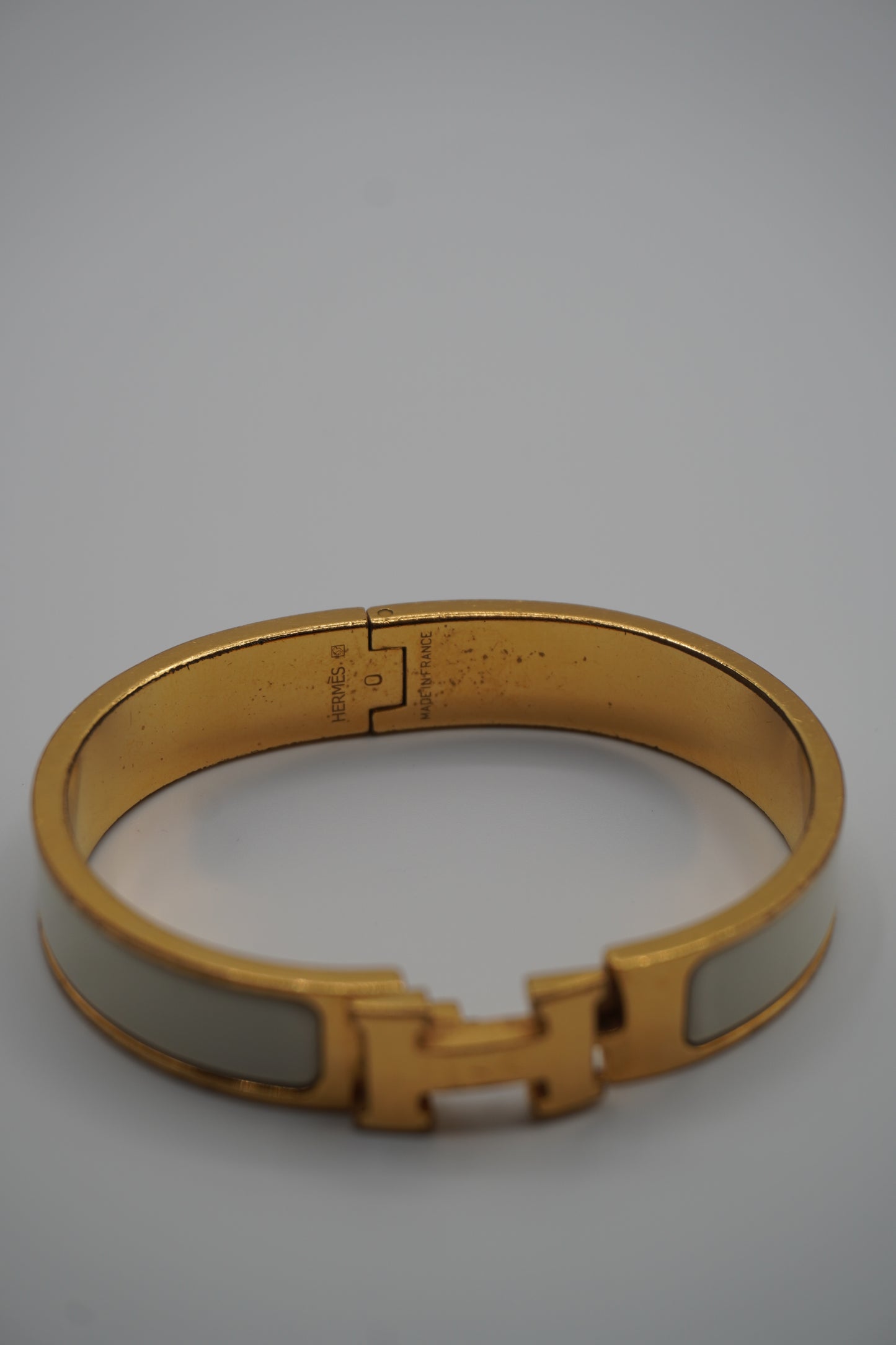 Hermès Clic H Bracelet in Gold & White Enamel