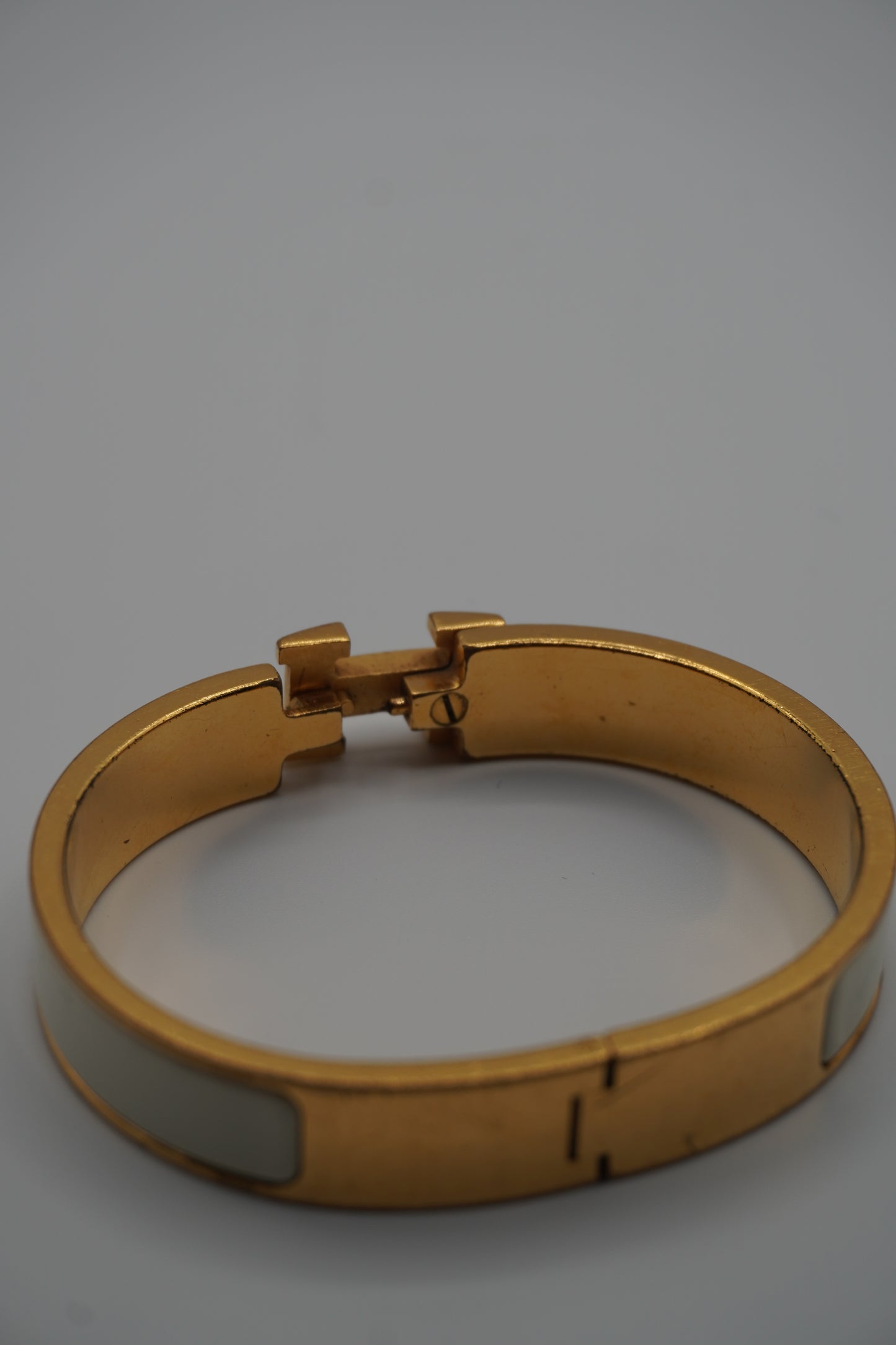 Hermès Clic H Bracelet in Gold & White Enamel