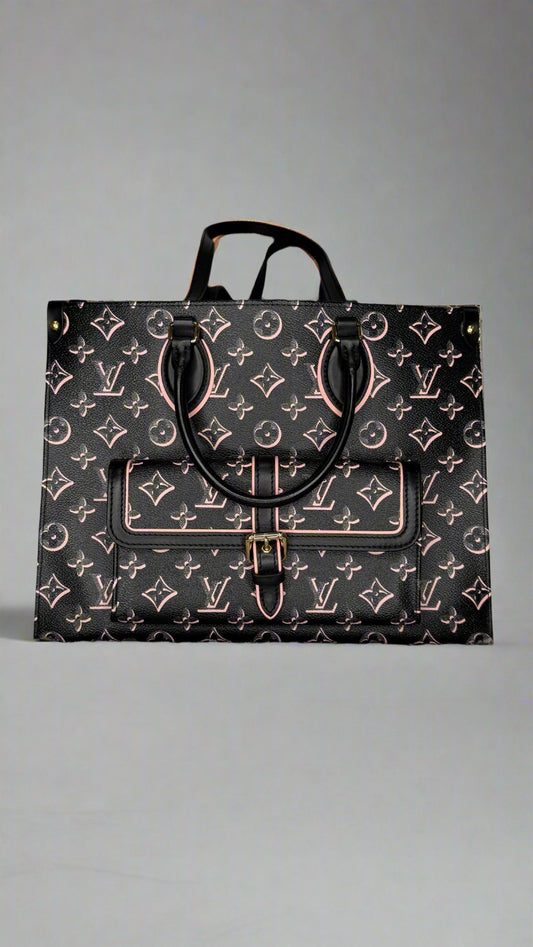 Designer handbag with monogram pattern on a textured surface