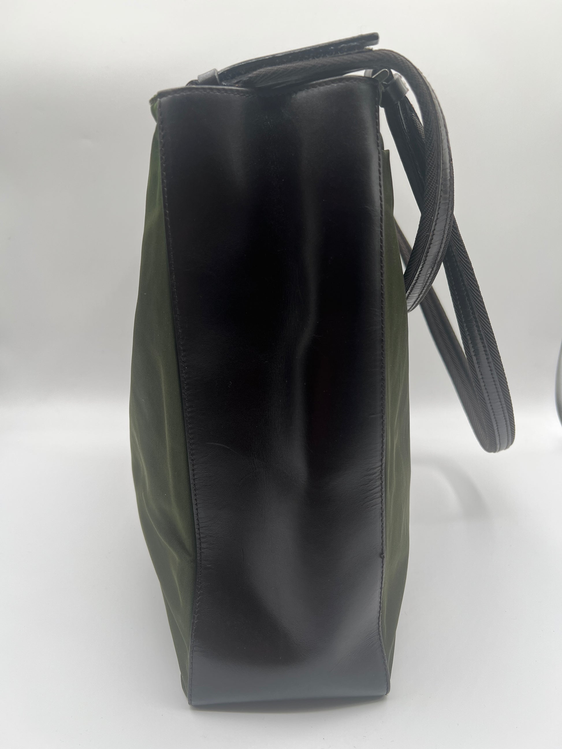 Black leather handbag on a white background