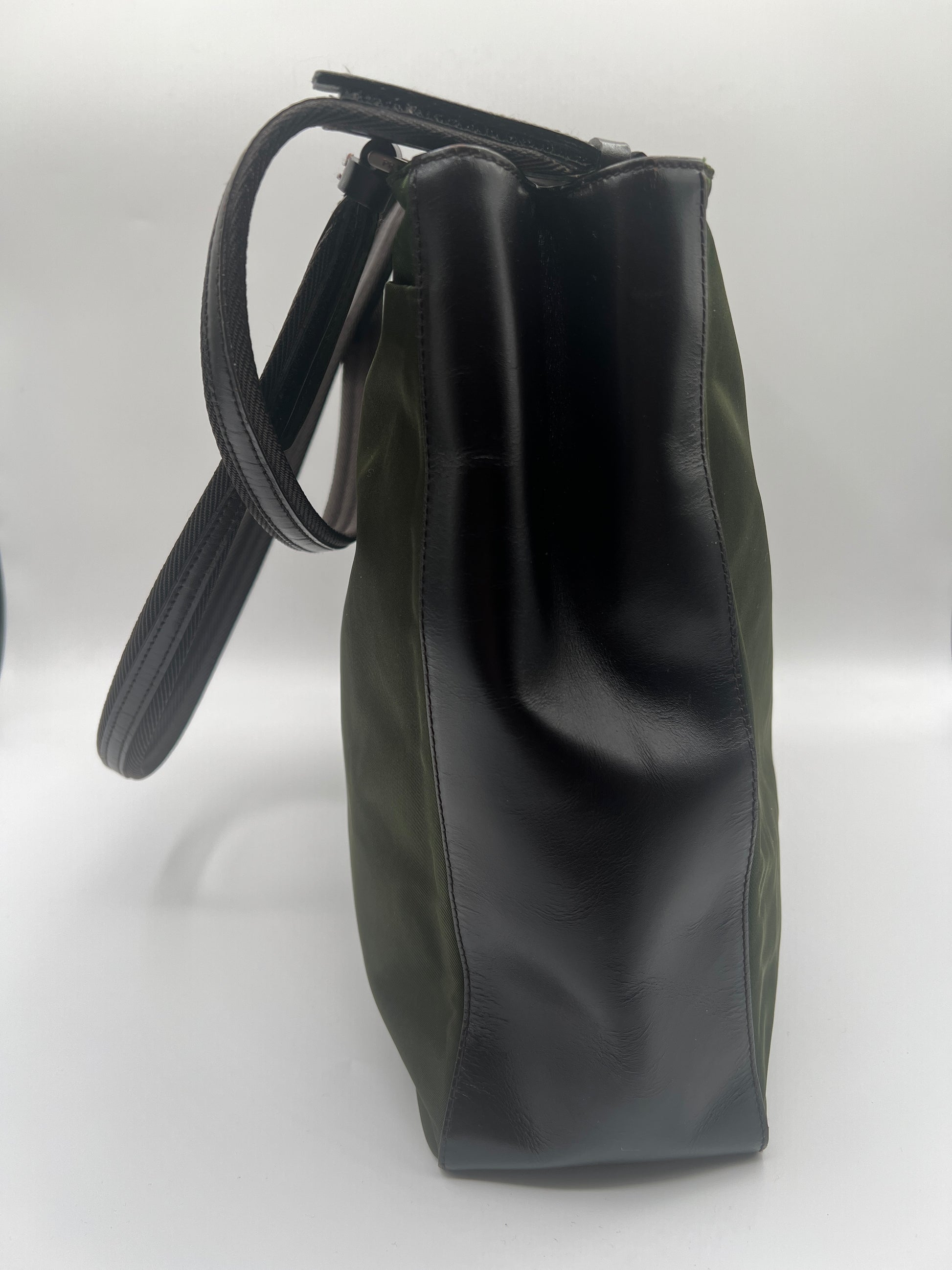 Black leather handbag on a white background