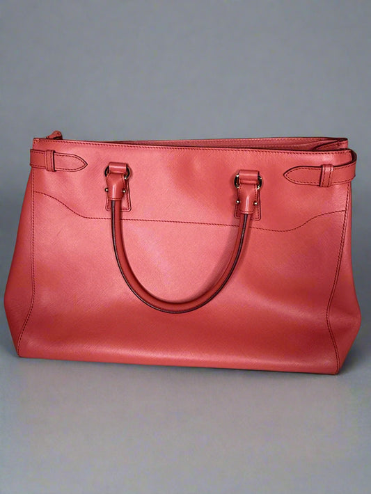 Red handbag on a gray background