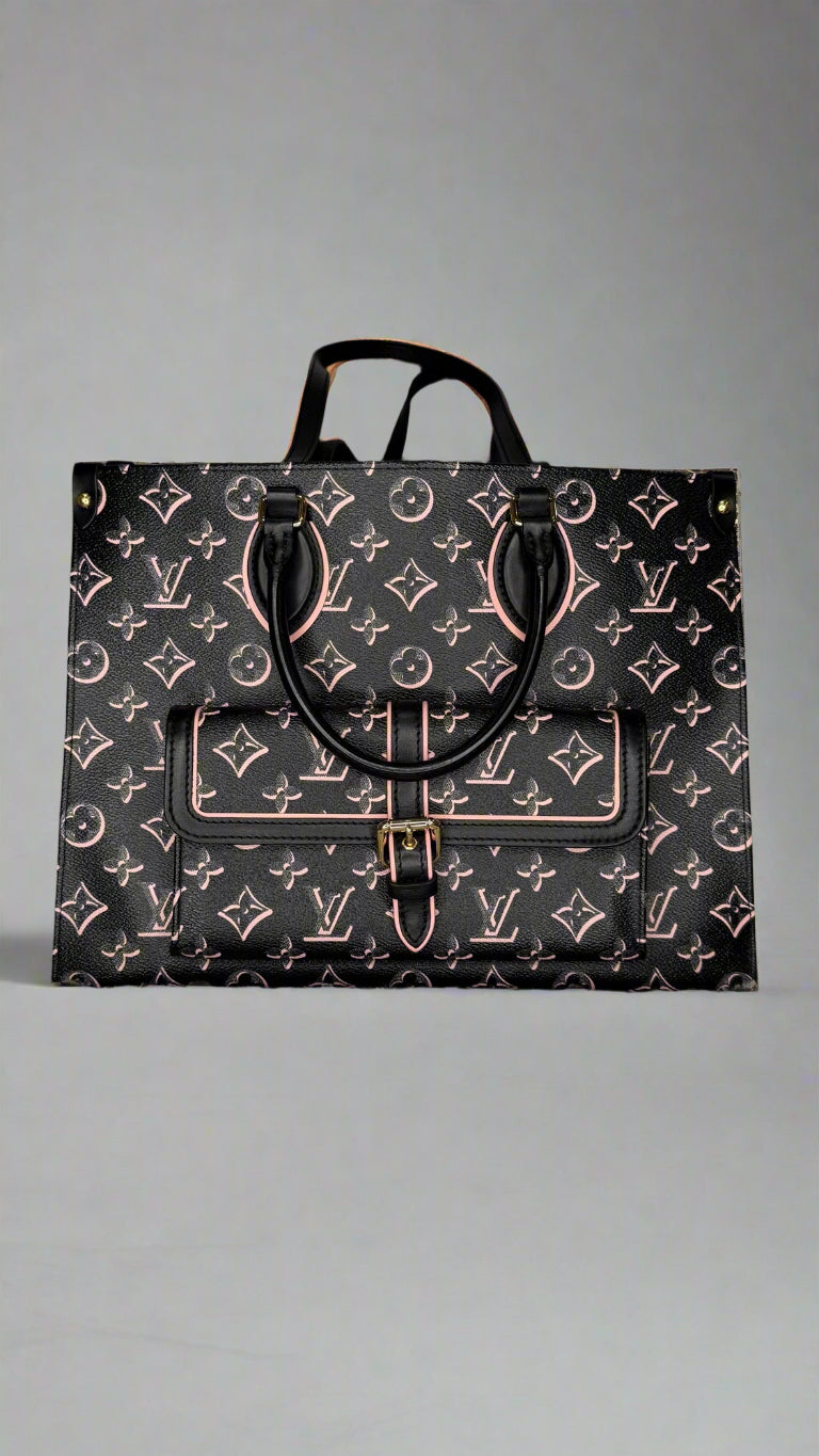 Designer handbag with monogram pattern on a textured surface