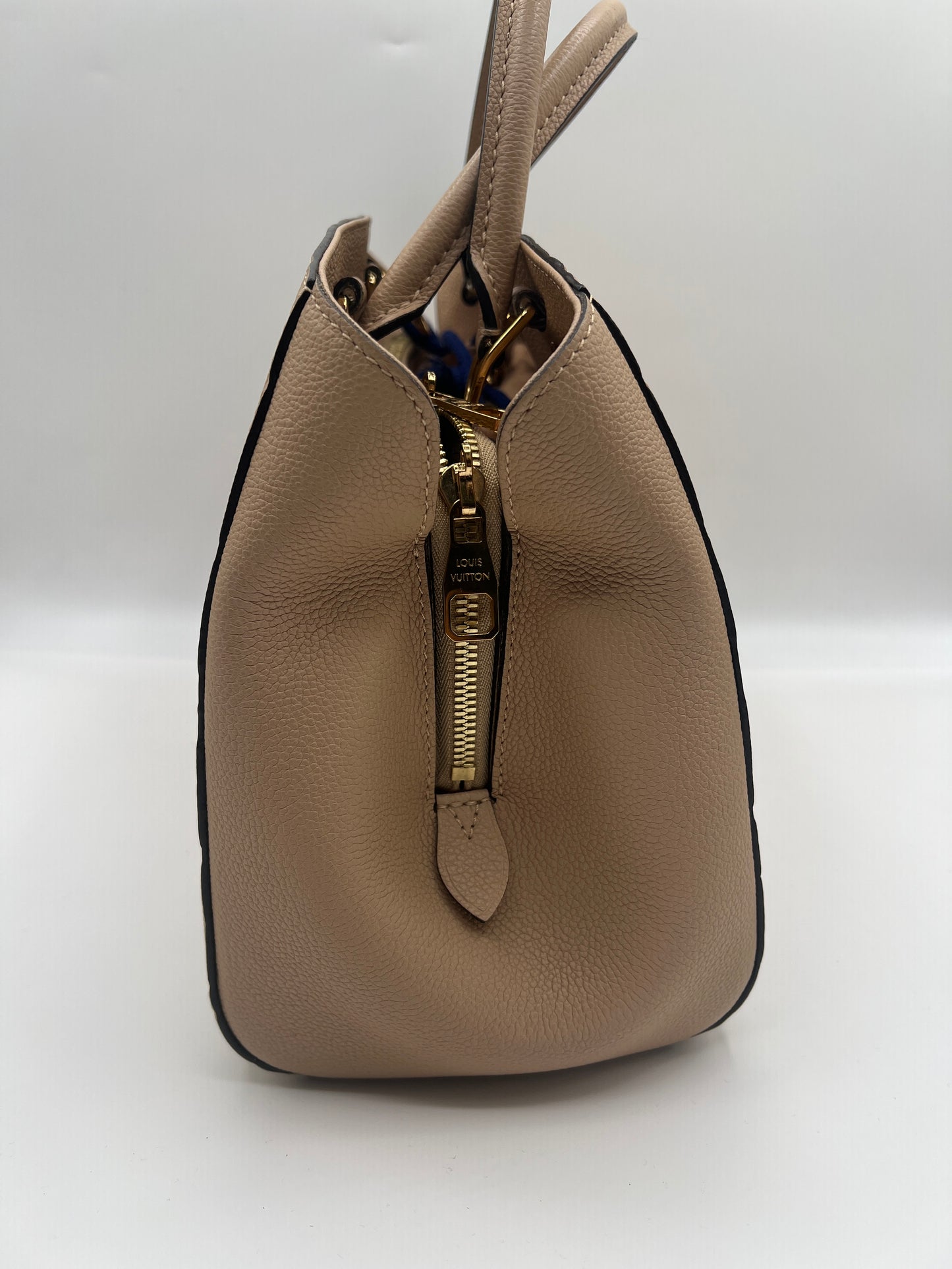 Louis Vuitton Montaigne MM in Dune Monogram Empreinte Leather