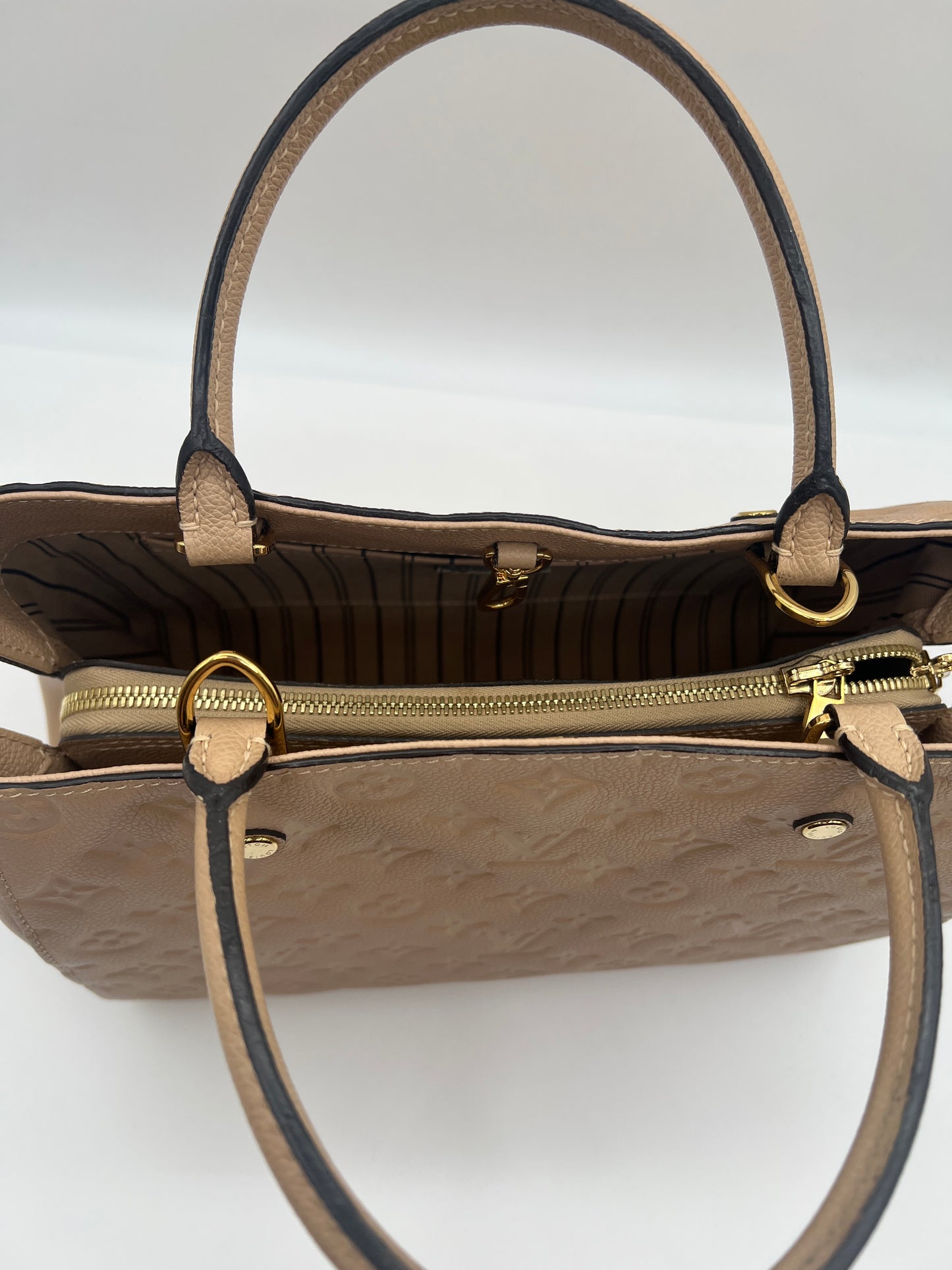 Louis Vuitton Montaigne MM in Dune Monogram Empreinte Leather