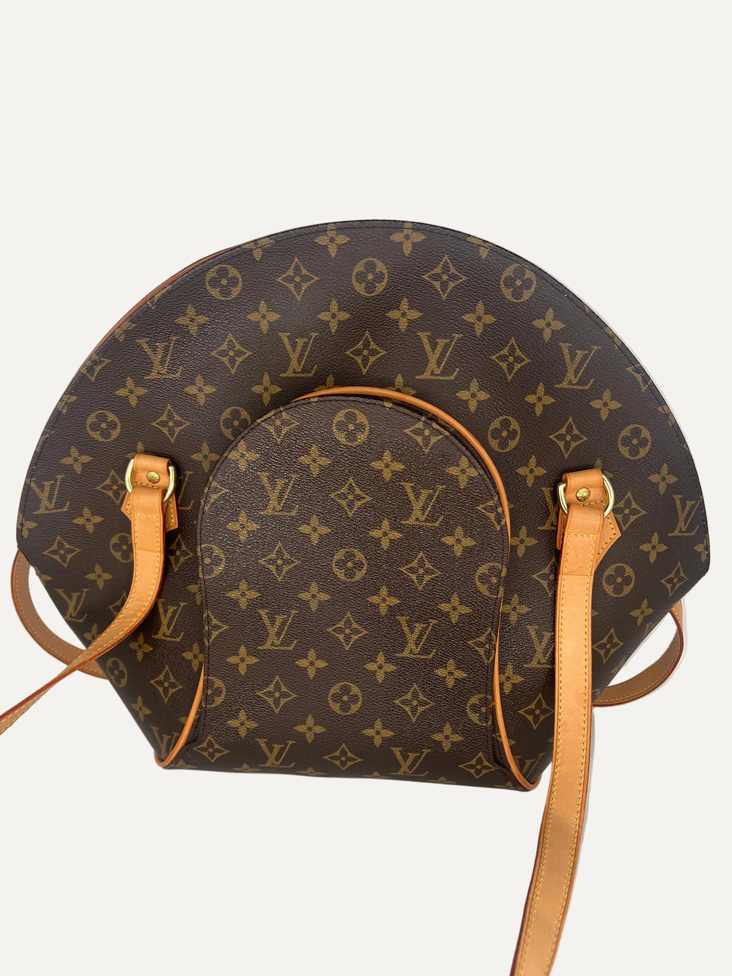 Louis Vuitton handbag with monogram pattern on a white background