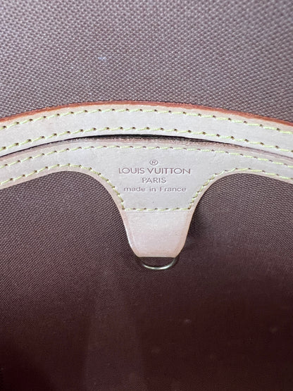 Close-up of a Louis Vuitton bag with visible branding and stitching detail.