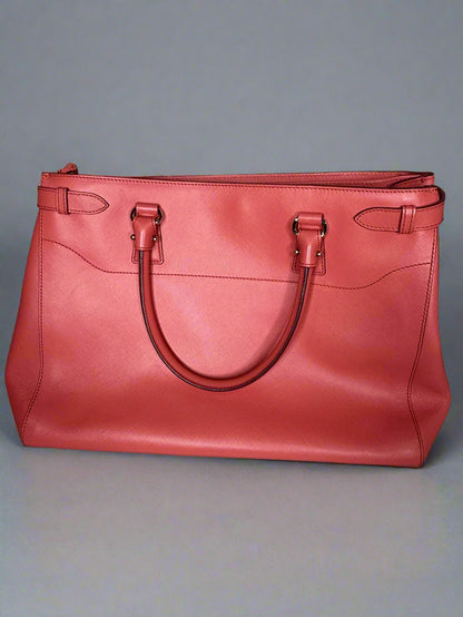 Red handbag on a gray background